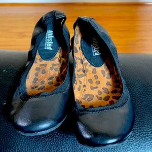 NWOT Unlisted black slip on flats.